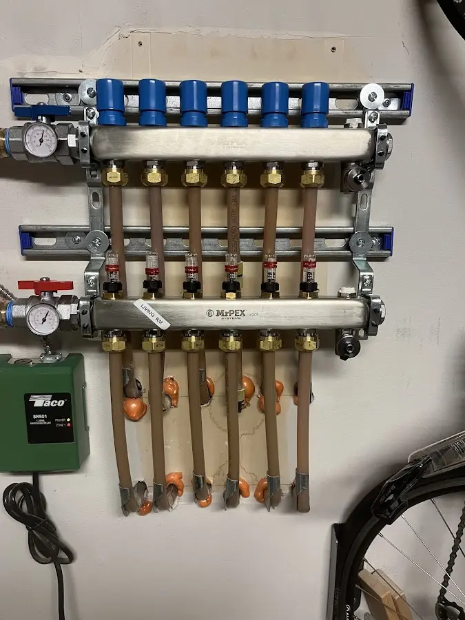 Plumber performing Water Heater Repair at a residential property in Country Club Estates